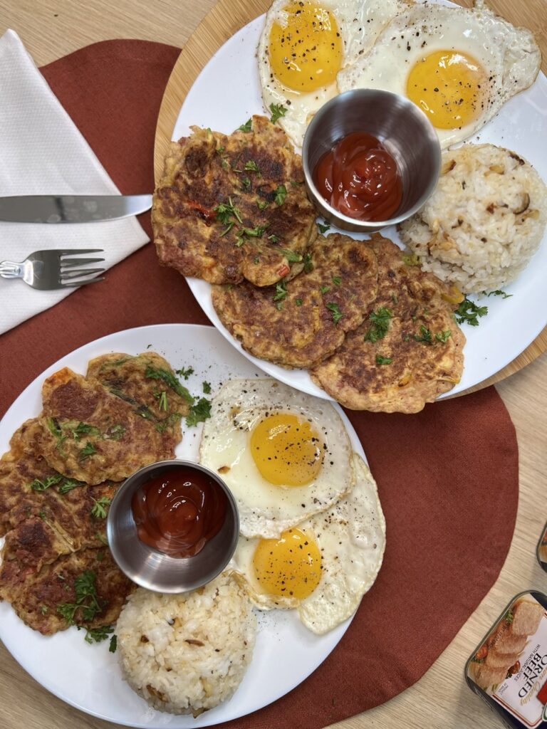 Corned Beef Patties with Sunny Side up Eggs, Garlic Fried Rice, and Ketchup. 