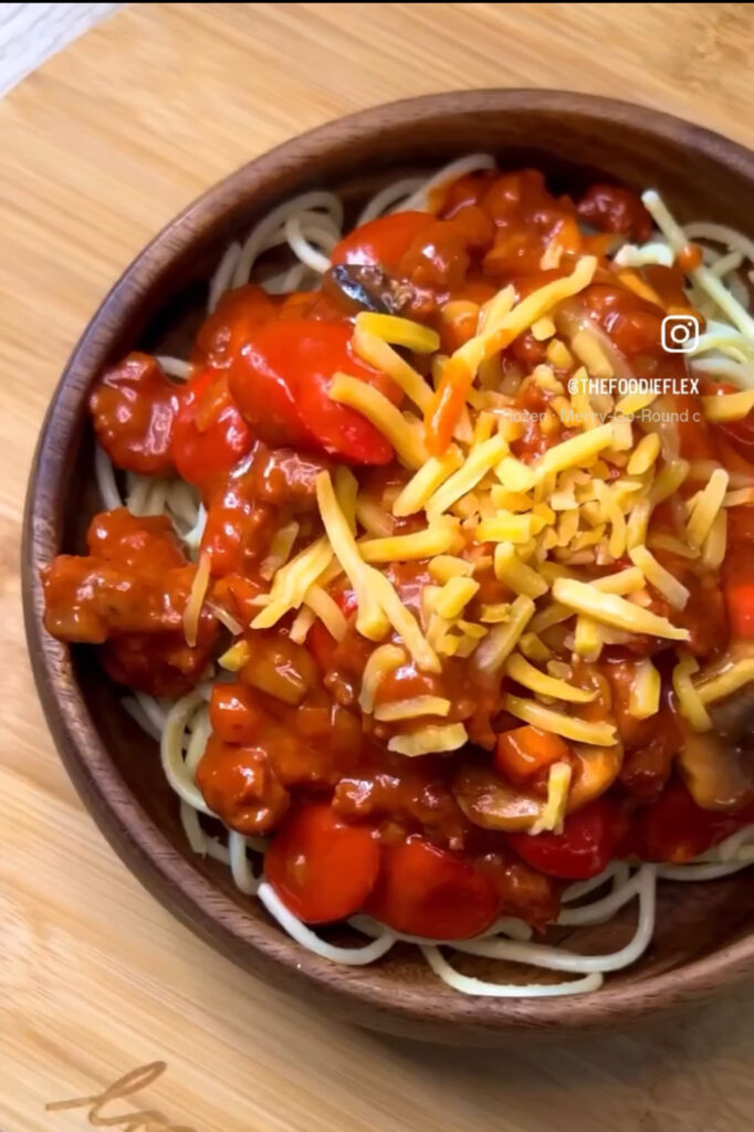 Filipino Spaghetti topped with cheddar cheese